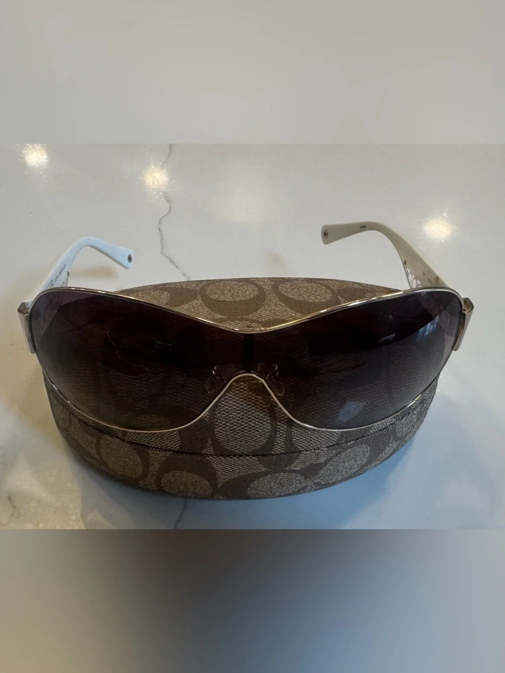 Women’s Coach Leanne S566 wrap golden sunglasses. White with signature C